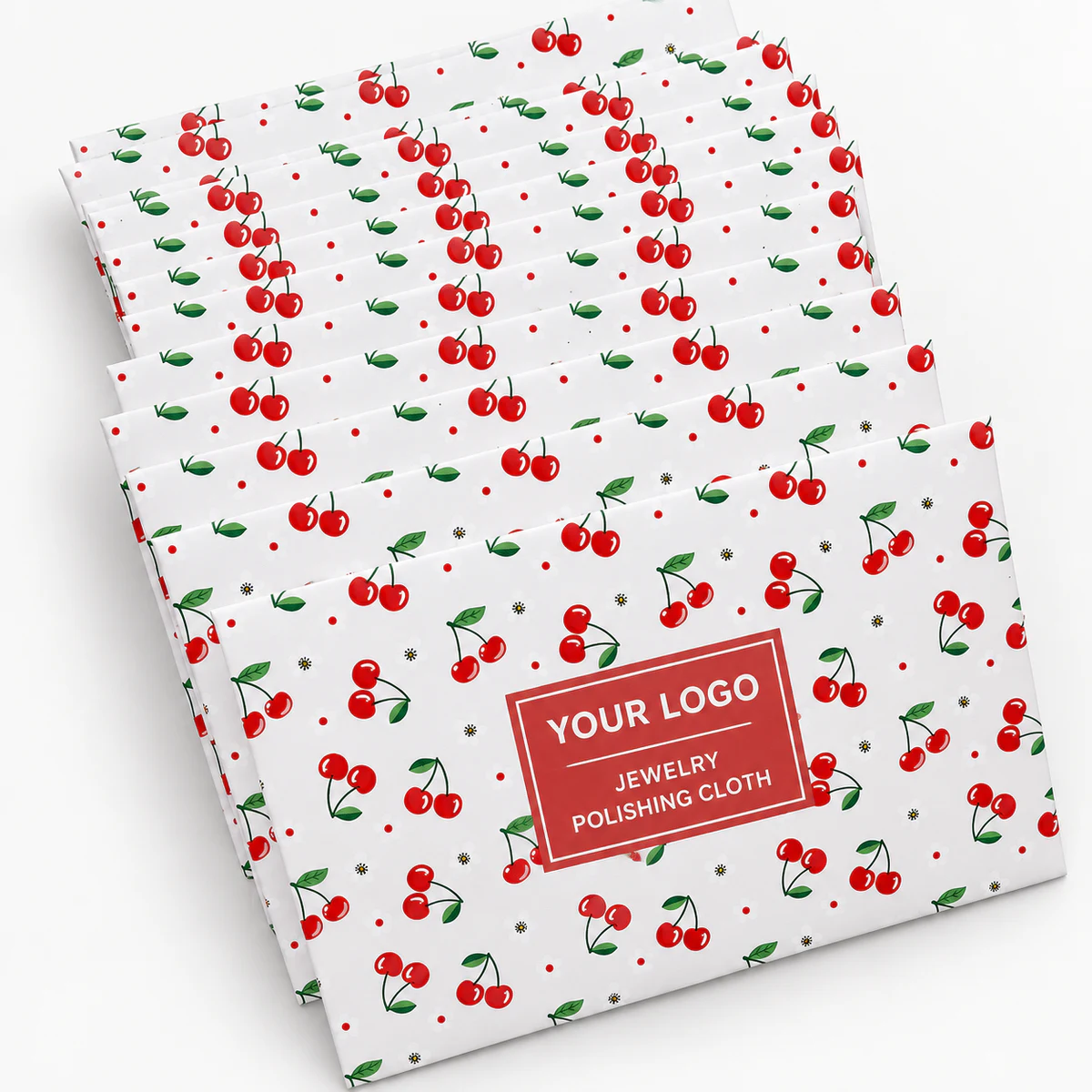 Stack of cherry-pattern custom printed paper packaging for jewelry polishing cloths
