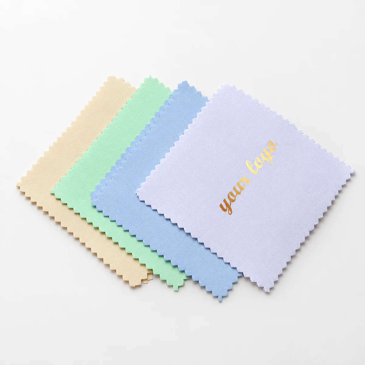 Pastel silver polishing cloths with a metallic gold Your logo print on a lavender cloth