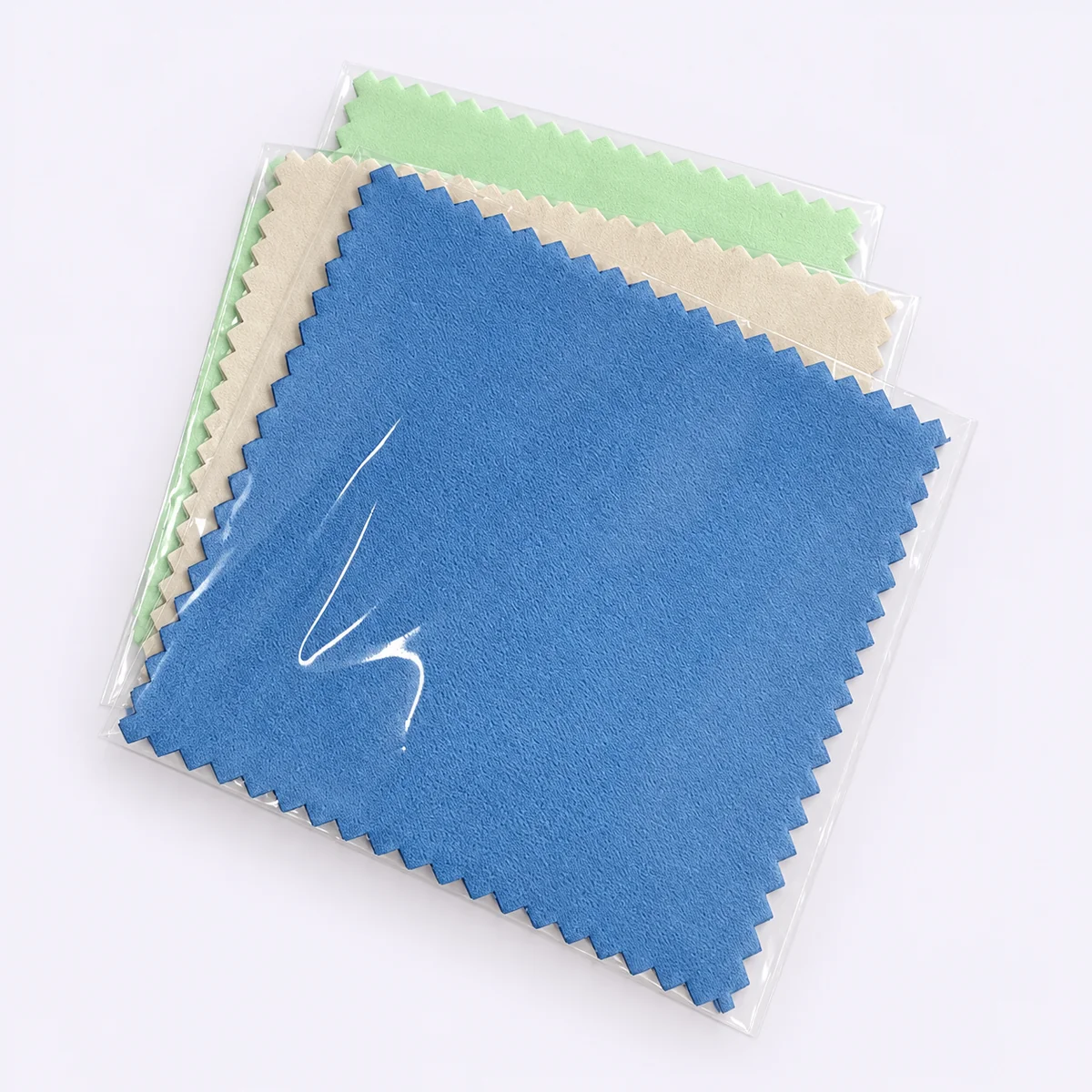 Blue silver polishing cloth in an individual clear sleeve on a pale gray background