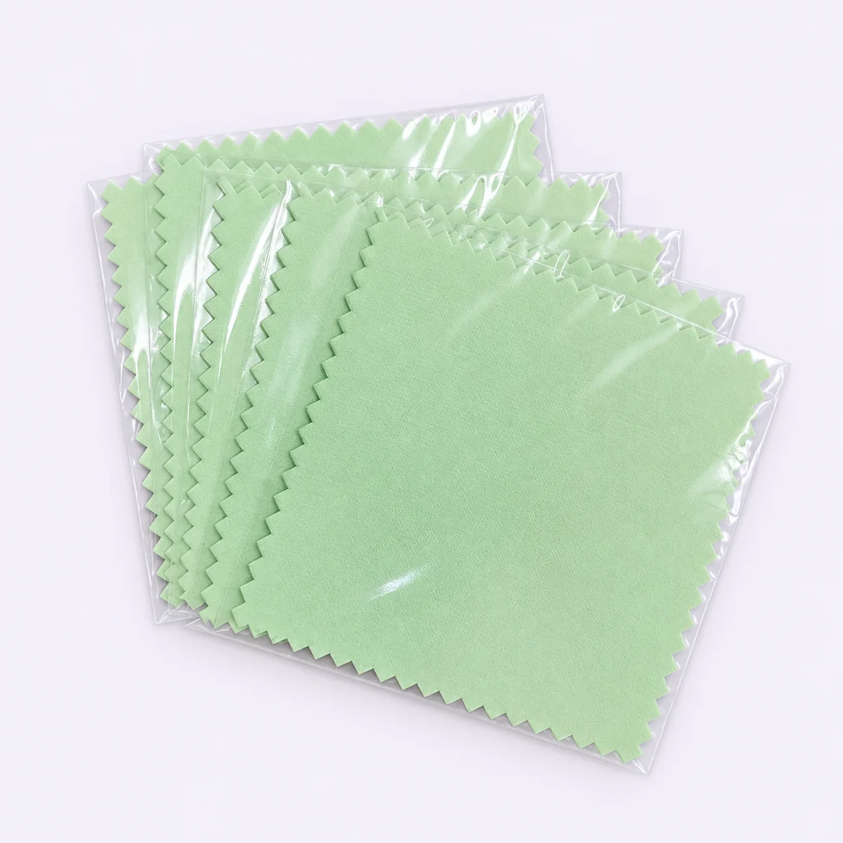 Mint green silver polishing cloth with pastel cloths in individual clear sleeves